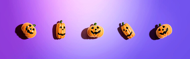 Miniature Halloween pumpkin ghosts - overhead view flat lay