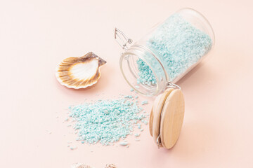 Blue bath salt in glass jar and seashell. Natural sea salt for skin and bath