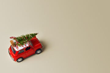 Little red toy car and Christmas tree
