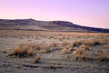 Dawn light over Over Owler Tor and Millstone Edge on a frosty morning, Peak District, UK