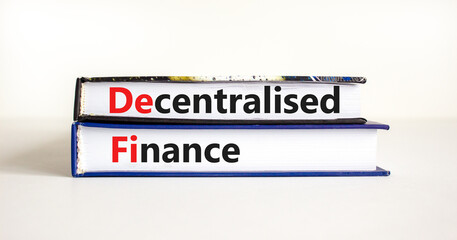 DeFi, Decentralised finance symbol. Concept words 'DeFi, Decentralised finance' on books. Beautiful white table, white background, copy space. Business and DeFi, decentralised finance concept.
