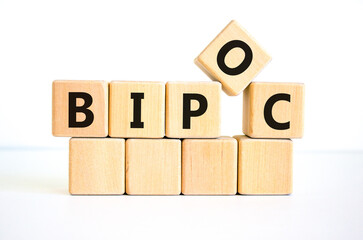 BIPOC symbol. Abbreviation BIPOC, black, indigenous and people of color on wooden cubes. Beautiful white background. Copy space. Business and BIPOC, black, indigenous and people of color concept.