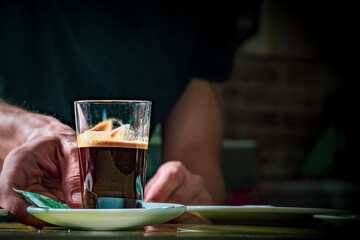 waiter delivering a coffee