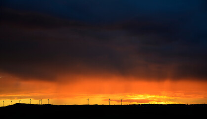 sunset with wind turbines