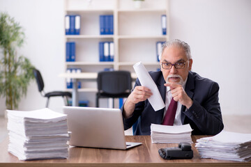 Fototapeta premium Old male employee in industrial espionage concept