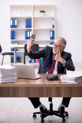 Old male employee and too much work in the office