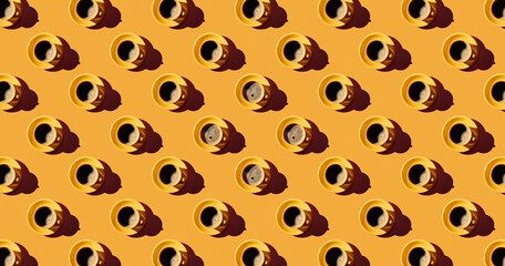Pattern of coffee mugs on yellow pastel background