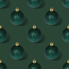 Seamless pattern with Christmas balls on green background.