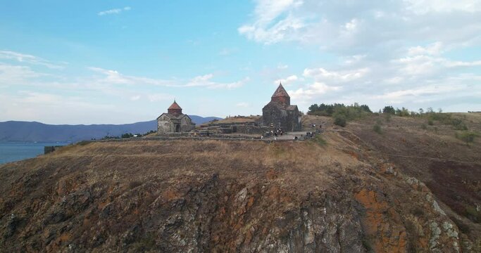 Sevanavank Monastery on Lake Sevan, Armenia. Flying around the Temple. The temple on the mountain.