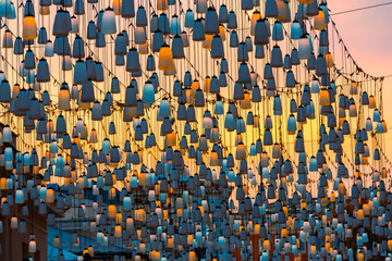 Street lights on Stoleshnikov lane. Moscow pedestrian street. Lights in the sunset. Beautiful backlighting and the blue sky in the background. Festive holidays city view