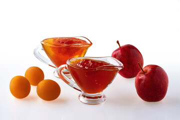 Jams of cherry plum and apples on a white background