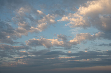 Clouds in the sky all the way to horizon line taken early evening just before sunset 