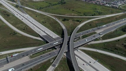 Aerial view of traffic on freeway overpass by day in Toronto, Ontario, Canada, North America, urban planning and transportation concept.