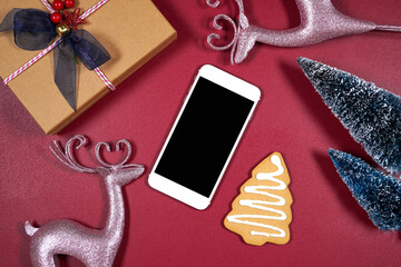 Smart phone product mockup. Christmas theme svg craft product mockup with pink reindeers, gift,...