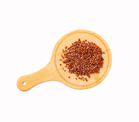 Red organic quinoa seeds on the wooden board - Chenopodium quinoa