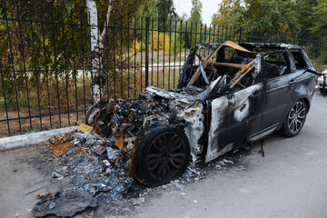 Burnt exploded car. Consequences of disaster or terrorist attack