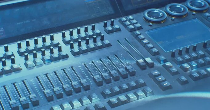 digital console with equalizers illuminated by beautiful light. close-up.