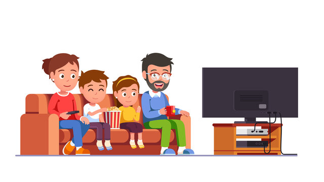 Family watching movie together sitting on sofa