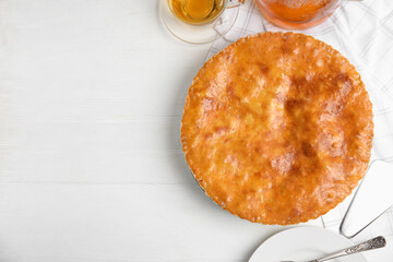 Delicious pie with meat on white wooden table, flat lay. Space for text