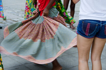 Women dancing the traditional samba de roda of Bahia with colorful clothes. Salvador, Bahia, Brazil.