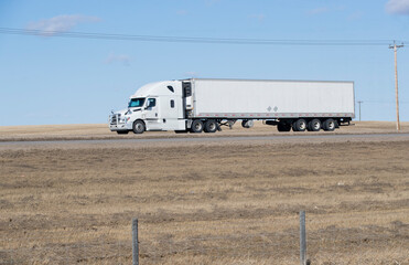 Heavy Cargo on the Road. A truck hauling freight along a highway