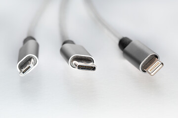 Fototapeta premium Three types of peripheral cables connectors for charging or data. Concept EU rules to change universal charge plug to USB C
