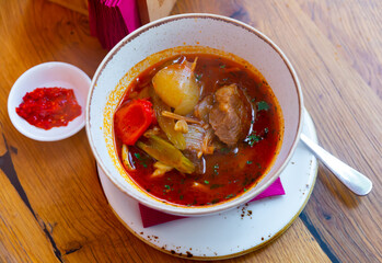 National hearty meat dish of the cuisine of Central Asia Lagman Uygur, which is a thick soup of lamb and vegetables