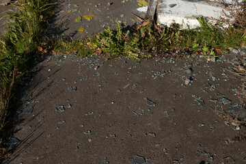 Broken glass in the windows of an old building. Vandals destroy an abandoned high-rise building. Day. Autumn. Russia.