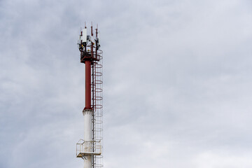 Telecommunication tower of 4G and 5G cellular. Base Station or Base Transceiver Station. Wireless Communication Antenna Transmitter. Telecommunication tower with antennas against blue sky