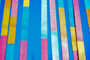 close-up of suspended colored slats, colorful wooden background, background, colorful background