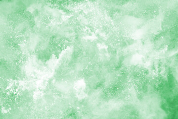 Fototapeta premium Green powder explosion on white background. Colored cloud. Colorful dust explode. Paint Holi.