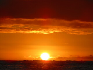 Beautiful sunset in Hawaii by ocean