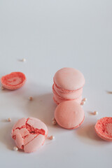 Pink french macaroons on white background. Sweet background. Copy space vintage tone