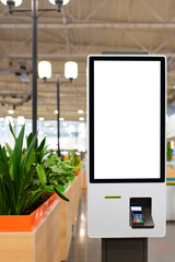 Self service electronic counter with blank mockups on white screen and payment terminal in fast food restaurant, shopping mall - obrazy, fototapety, plakaty