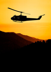 Obraz na płótnie Canvas American utility military helicopter in the flight