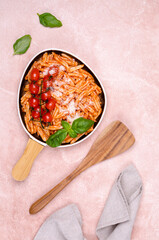 Pasta with tomatoes, red sauce and cheese