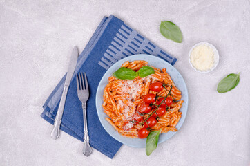 Pasta with tomatoes, red sauce and cheese