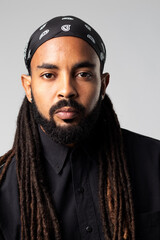 Latin with beard , dreadlocks and headscarf