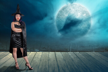 Asian witch woman with a hat standing