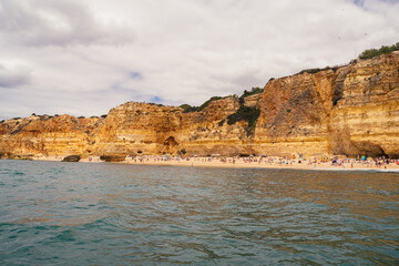 Fototapeta na wymiar beach among the rocks in the sea