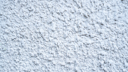 White external textured plaster. Structure of white cement plaster. Building facade background. Stucco wall