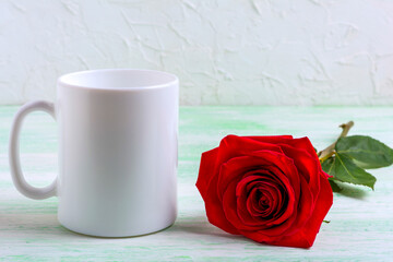 White coffee mug mockup with dark red rose