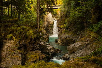 A waterfall under a bridge