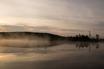 A view of a lake on a misty morning