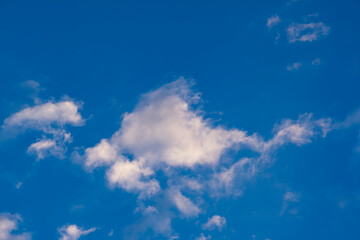 Blue sky with clouds at sunrise. Morning sky background