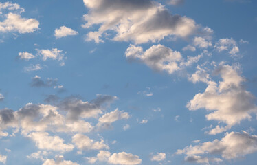 Blue sky with clouds at sunrise. Morning sky background