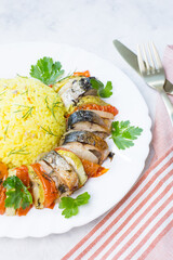 Baked mackerel with vegetables. Ready-made seafood dish.