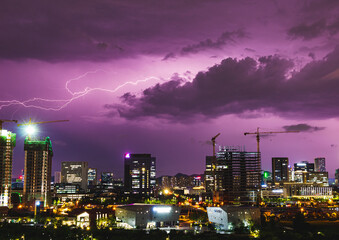 lightning in a purple sky over the city