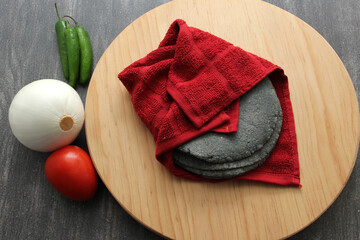 Fresh, delicious, freshly made blue dough tortillas along with a variety of fresh vegetables:...