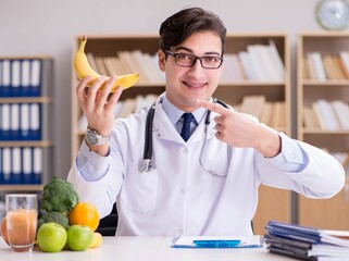 Doctor in dieting concept with fruits and vegetables